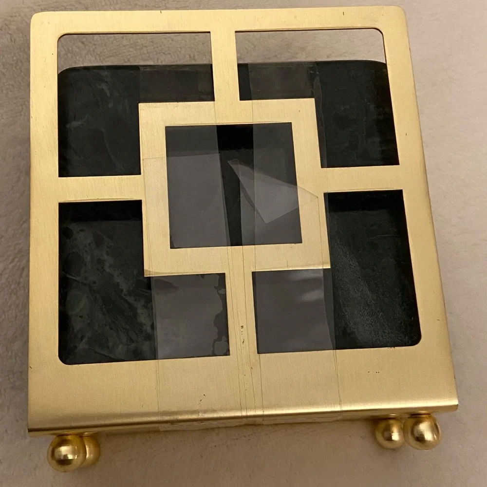 Dark green marbled ceramic coasters with gold holder. 4x4